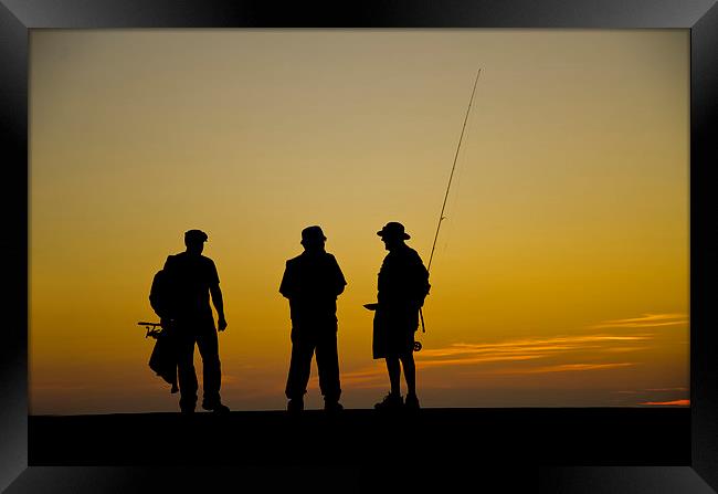 Three fishermen at sunset Framed Print by Andrew chittock