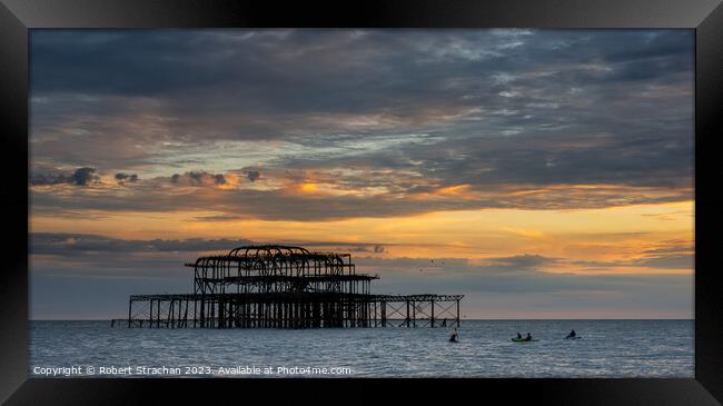 Brighton Pier sunset Framed Print by Robert Strachan