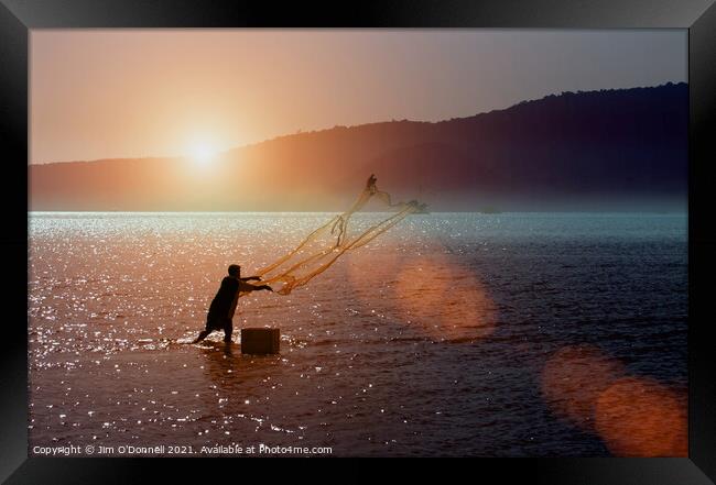 A Thai fisherman at sunrise Framed Print by Jim O'Donnell
