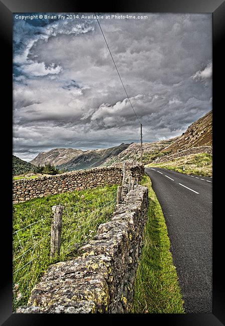 Cumbrian mountain road Framed Print by Brian Fry