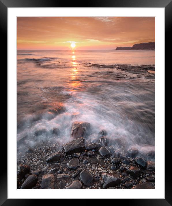 Pebbles on Kimmeridge bay at Sunset Framed Mounted Print by Kevin Browne