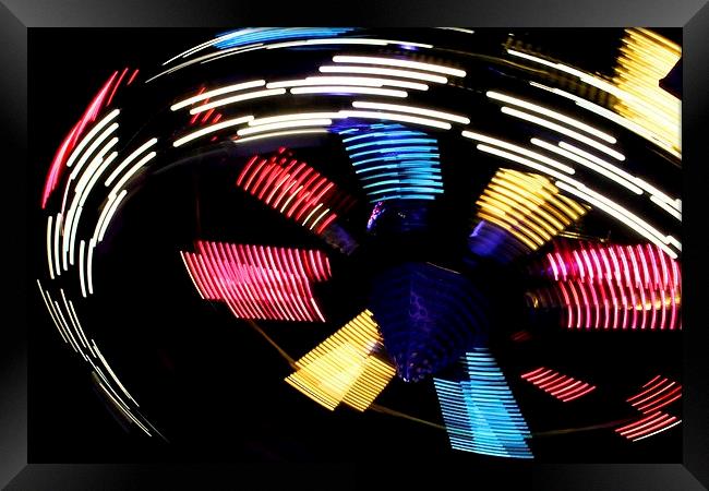 Spinning motion blur Framed Print by Helen Cooke