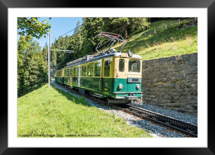 Swiss train at Lauterbrunnen Framed Mounted Print by Keith Douglas