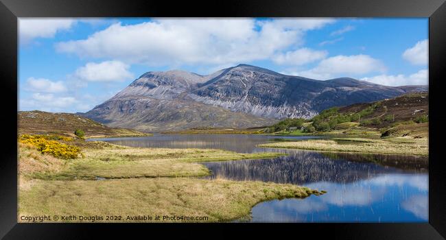 Arkle reflected in the loch Framed Print by Keith Douglas