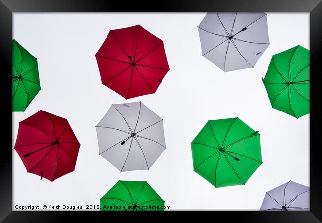 Italian Umbrellas in the sky Framed Print by Keith Douglas