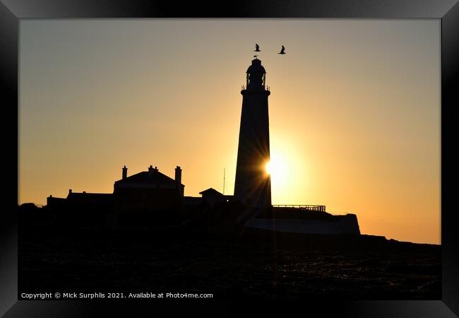 Sunrise biting a chunk out of St Marys Lighthouse Framed Print by Mick Surphlis