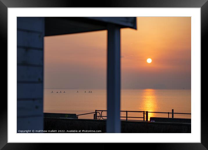 Sunrise Through Dovercourt Beach Huts Framed Mounted Print by matthew  mallett