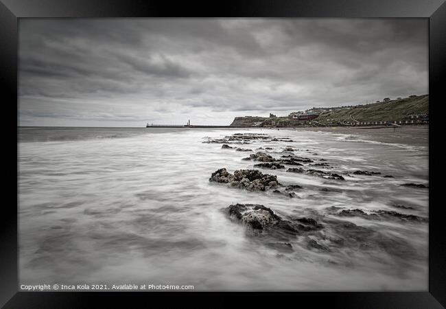 Stormy clouds over Whitby Beach Framed Print by Inca Kala