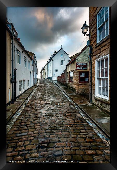 Whitby's Cobbled Streets and Fortune's Kipper House Framed Print by Inca Kala