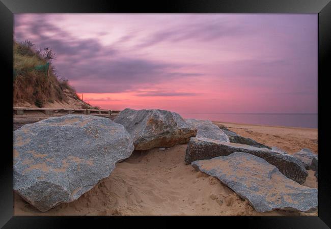  Sunset by the Rocks at Hemsby Beach Framed Print by James Taylor