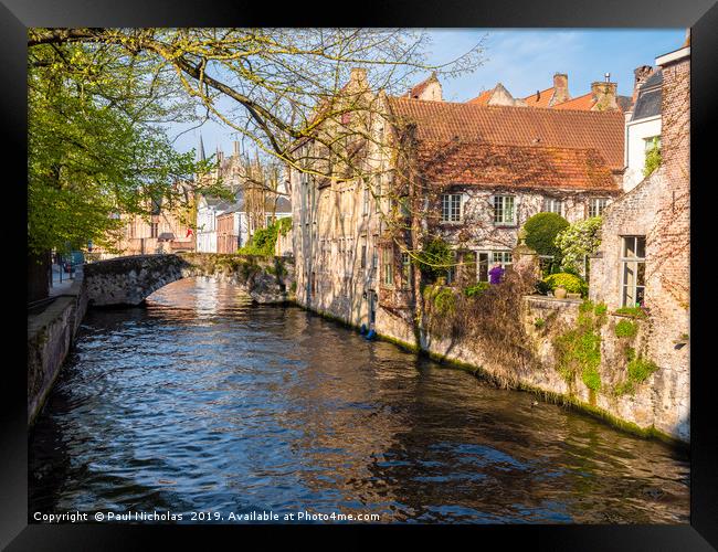 Bruges canal on a spring morning Framed Print by Paul Nicholas