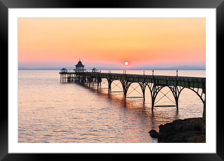 Clevedon pier, UK, Golden sunset Framed Mounted Print by Daugirdas Racys