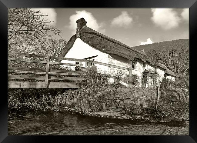 Cottage By The Stream Framed Print by Mike Gorton