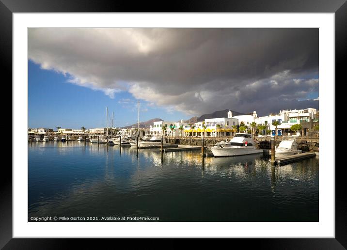 Storm clouds over Playa Blanca Marina Lanzarote Framed Mounted Print by Mike Gorton