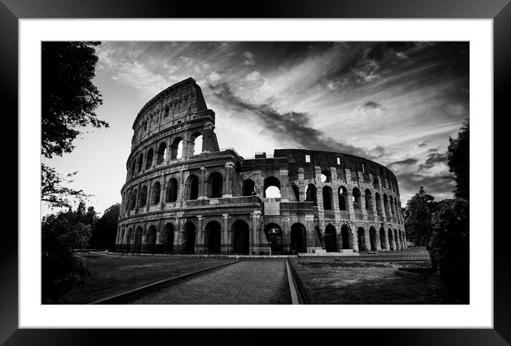 The fascinating sunset silhouette of the Colosseum in black and white. Framed Mounted Print by Guido Parmiggiani