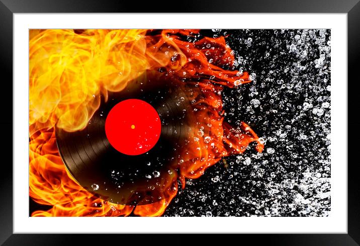 vinyl record with fire and water Framed Mounted Print by Guido Parmiggiani