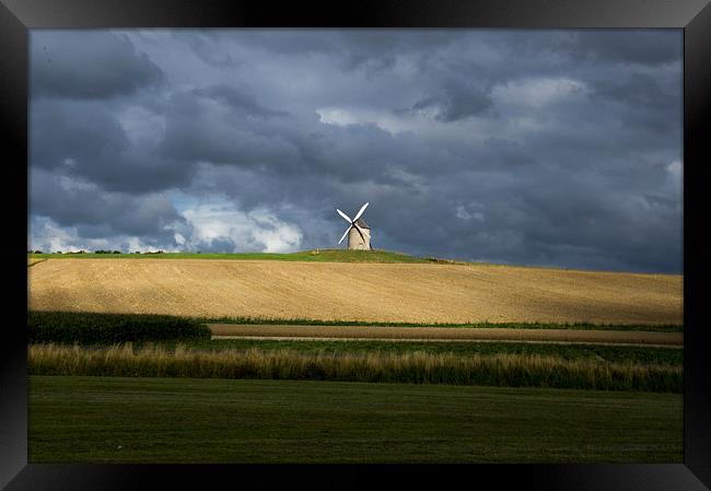 windmill on a stormy day Framed Print by Eric Fouwels
