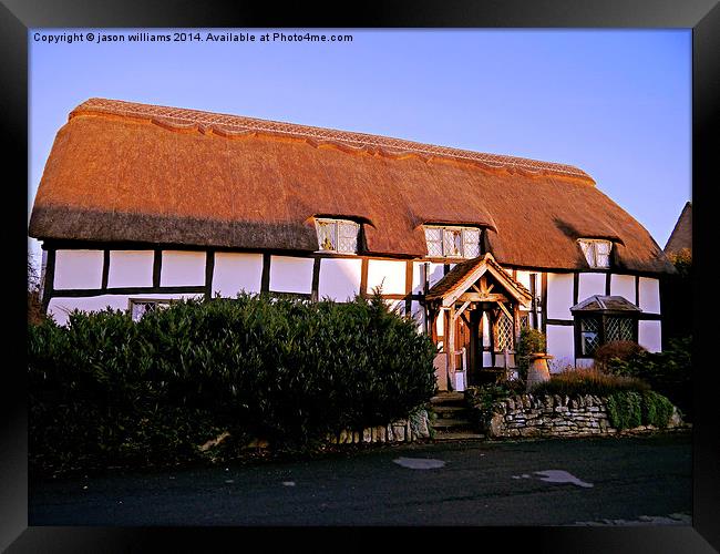 Old thatched  cottage in warm Sunlight. Framed Print by Jason Williams