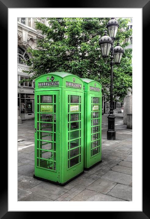 Green telephone boxes Framed Mounted Print by Andy Huntley