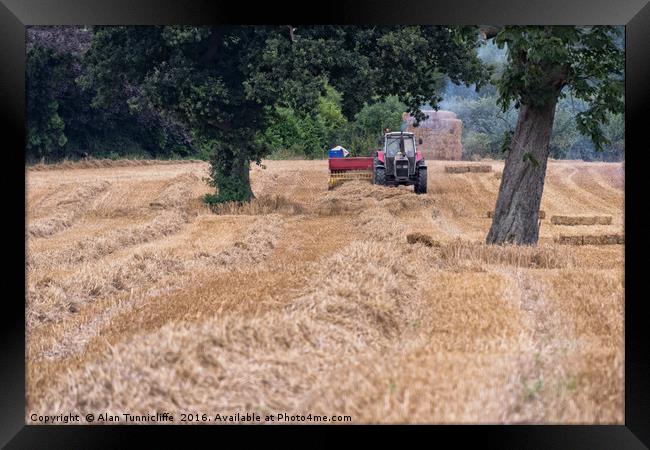 Baling straw Framed Print by Alan Tunnicliffe