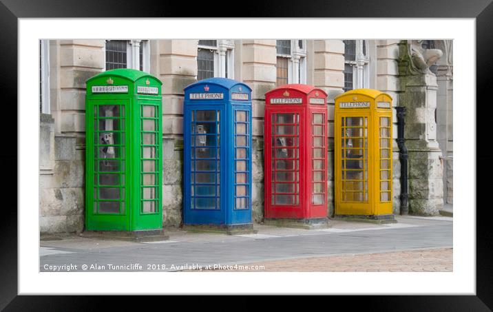 Colourful telephone boxes Framed Mounted Print by Alan Tunnicliffe