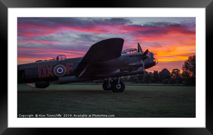 Lancaster bomber Just Jane with a sunset Framed Mounted Print by Alan Tunnicliffe