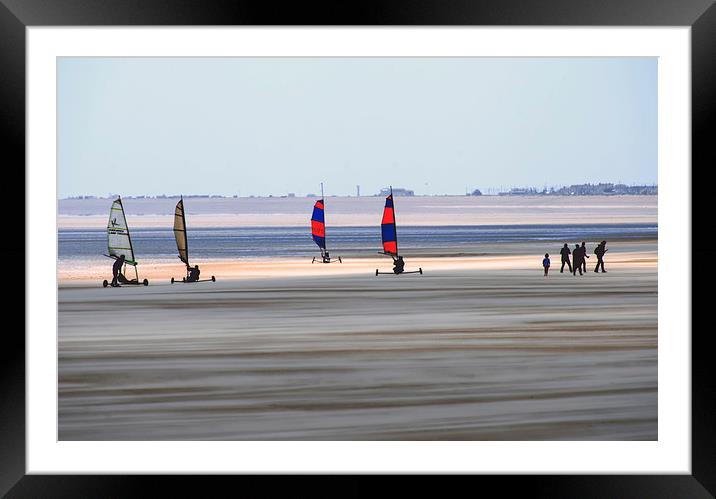Wind Sand surfers on a stormy day with sand blowin Framed Mounted Print by Susan Sanger