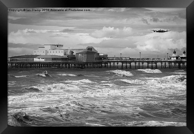 Bomber over the pier Framed Print by Ian Clamp