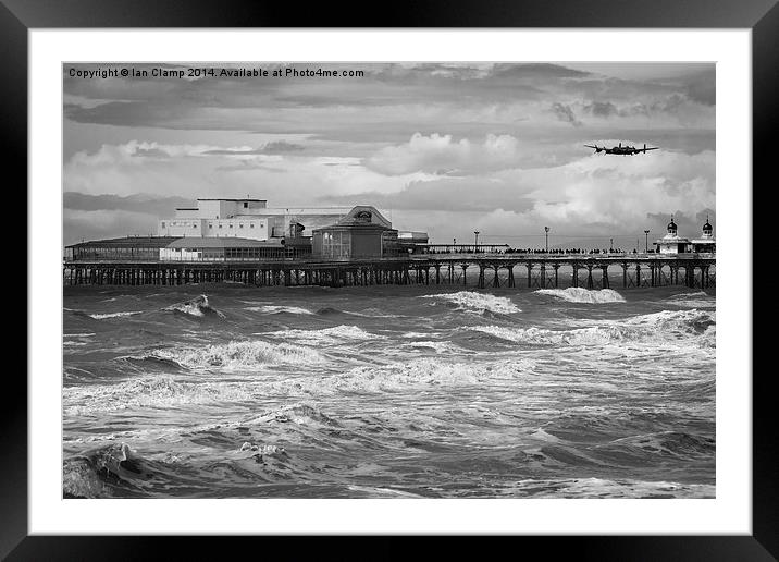 Bomber over the pier Framed Mounted Print by Ian Clamp