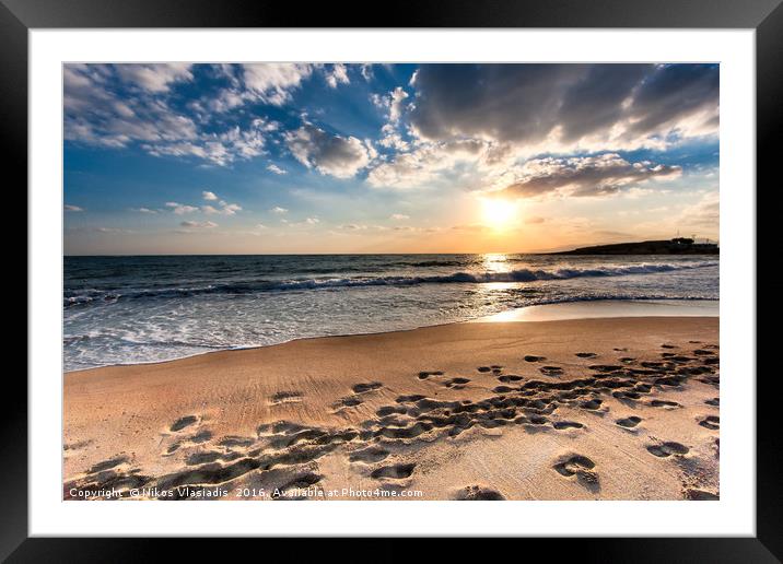 Cloudy sunset over a deserted beach of Crete Framed Mounted Print by Nikos Vlasiadis