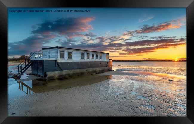 Dramatic sunset over a houseboat in Bramble Bush Bay Framed Print by Helen Hotson