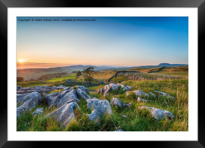 Sunset with clear blue skies over a limestone pavement at the Wi Framed Mounted Print by Helen Hotson