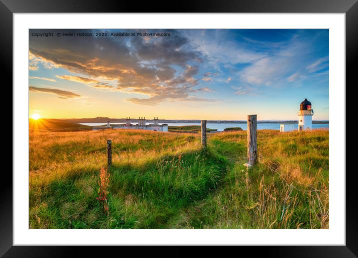 Beautiful sunset over the lighthouse and coastguar Framed Mounted Print by Helen Hotson