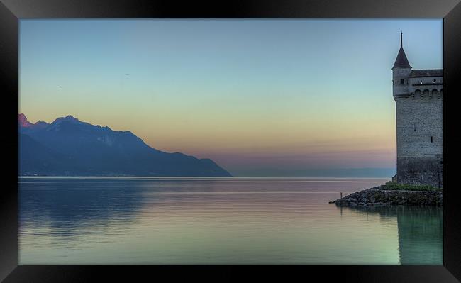 Chillon Castle by the lake at sunrise Framed Print by Olavs Silis