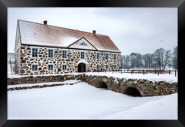Hovdala Castle in a Winter Wonderland Framed Print by Antony McAulay