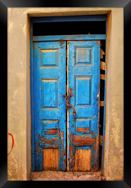 worn down blue door Framed Print by Antony McAulay