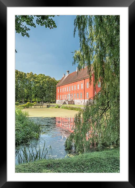 Hviderup Slott with reflection in moat. Framed Mounted Print by Antony McAulay