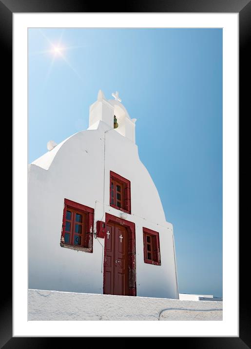 Oia Village Church with sunflare Framed Mounted Print by Antony McAulay