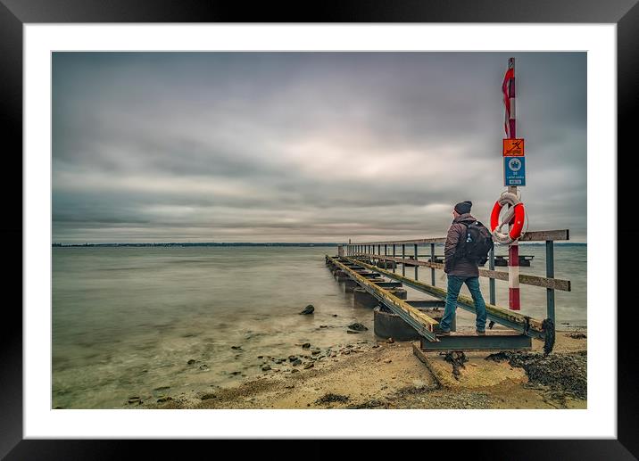 Larod Beach Pier with Man Framed Mounted Print by Antony McAulay