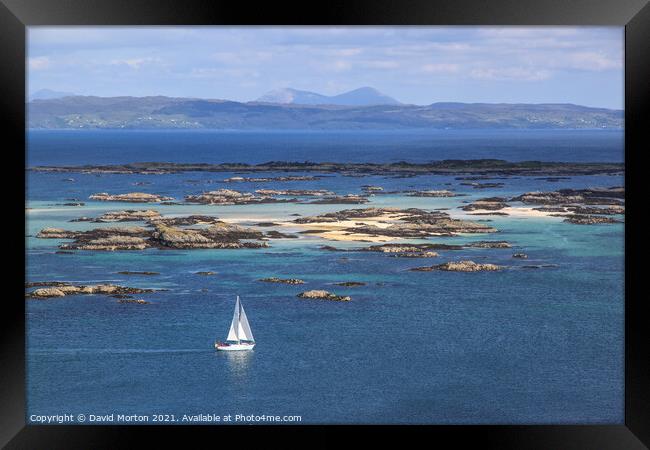 Yacht sailing therough the Skerries off Arisaig Framed Print by David Morton