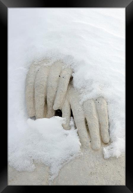 Snow covered hands of a statue Framed Print by Matthias Hauser