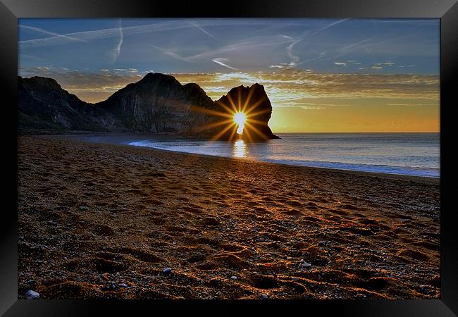 Sunrise through Durdle Door on a winter morning  Framed Print by Shaun Jacobs