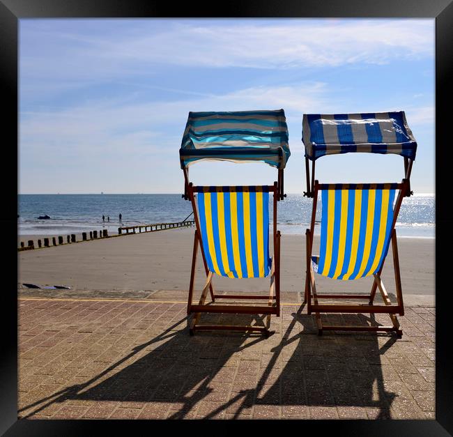 Deck chairs on the beach  Framed Print by Shaun Jacobs