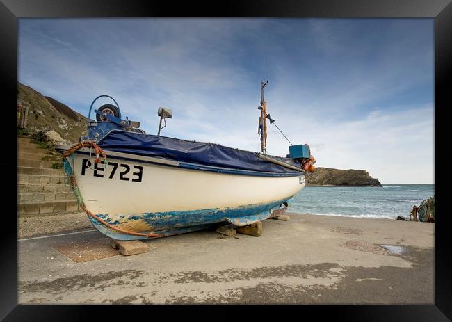 Lulworth cove fishing boat  Framed Print by Shaun Jacobs