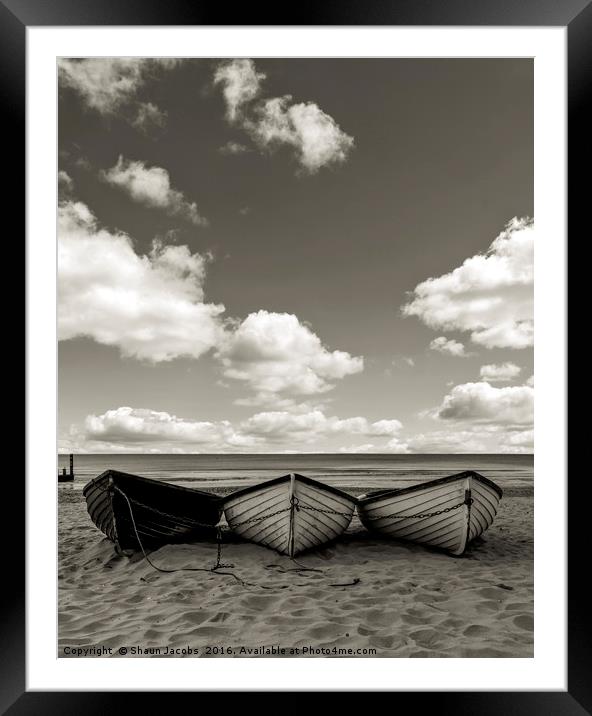 Fishing boats on a beach Framed Mounted Print by Shaun Jacobs