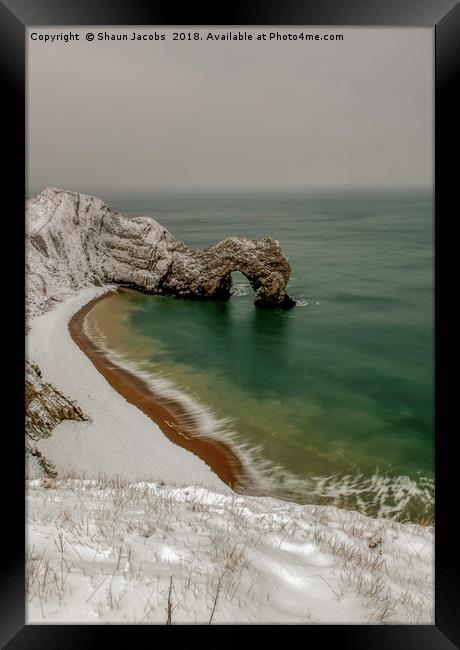Durdle Door covered in snow  Framed Print by Shaun Jacobs