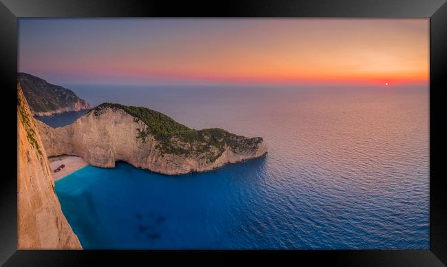 Navagio Beach - Shipwreck Cove at sunset Framed Print by Kelvin Trundle