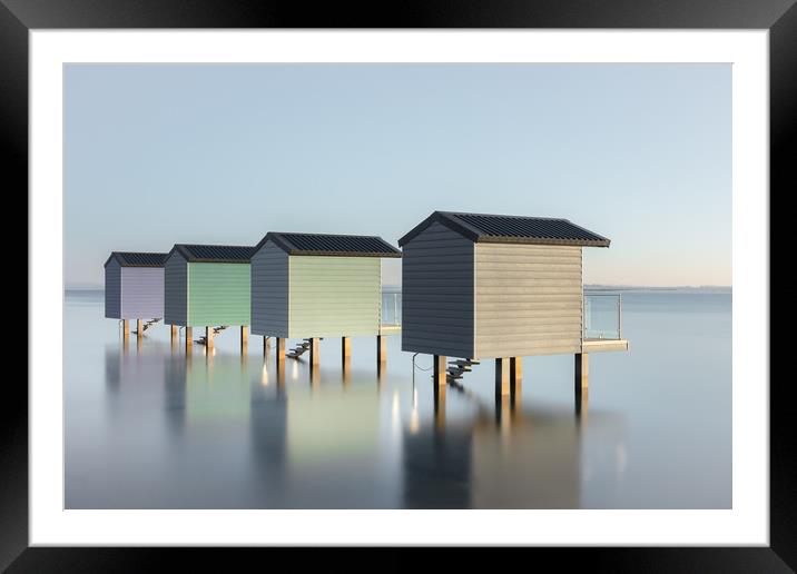 Pastel Beach Huts at high tide Framed Mounted Print by Kelvin Trundle