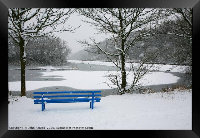 A snow covered blue bench at Bathpool Kidsgrove St Framed Print by John Keates