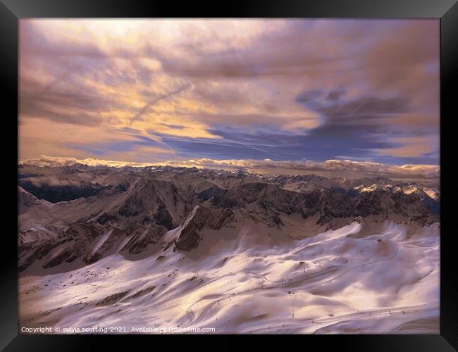 Mountains meet sky Framed Print by sylvia scotting